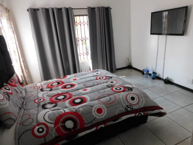 Kopano B&B bedroom with flat-screen TV