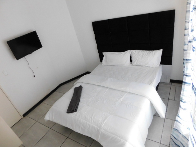 Kopano B&B bedroom with wall-mounted TV